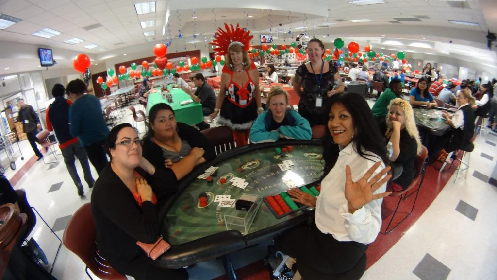 Guests and a dealer playing blackjack at a Casino Party Events celebration