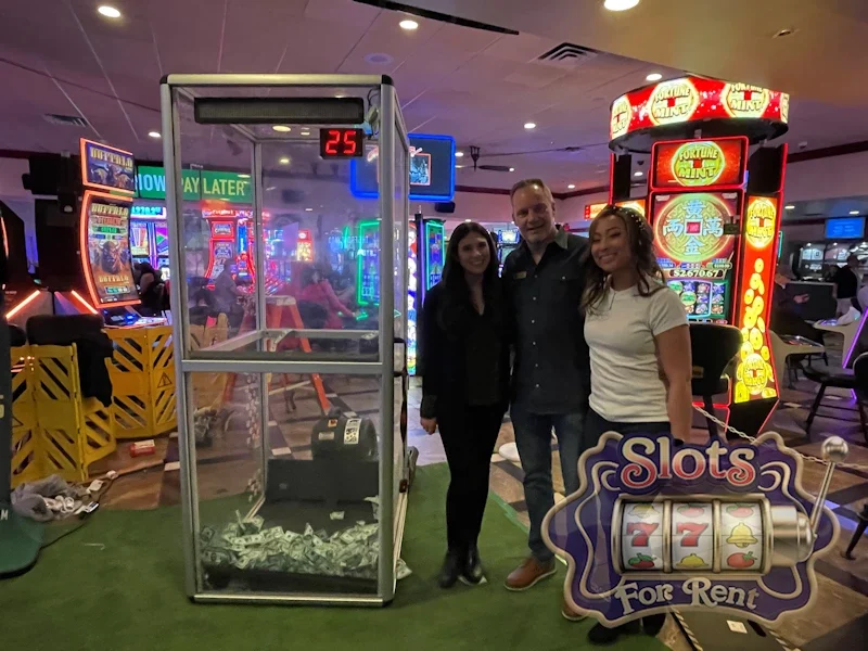 Guests beside a money booth at an event