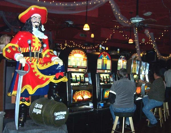 Casino-themed event with decorative figures and slot machines